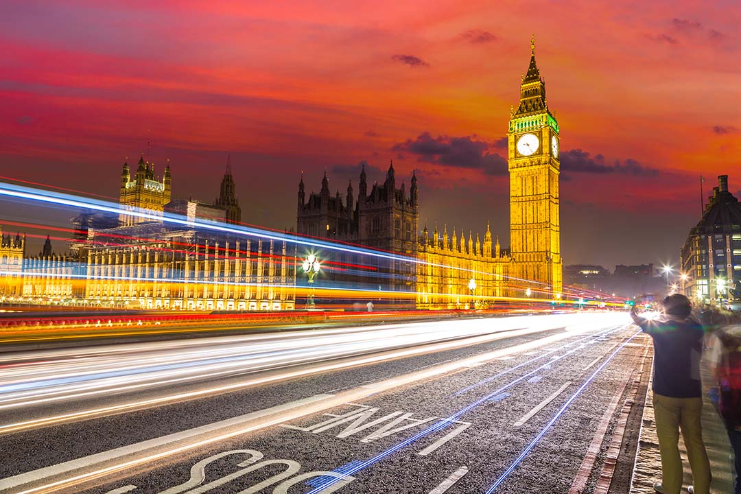 London Big Ben and traffic on Westminster Bridge in a beautiful summer night, London, England, United Kingdom